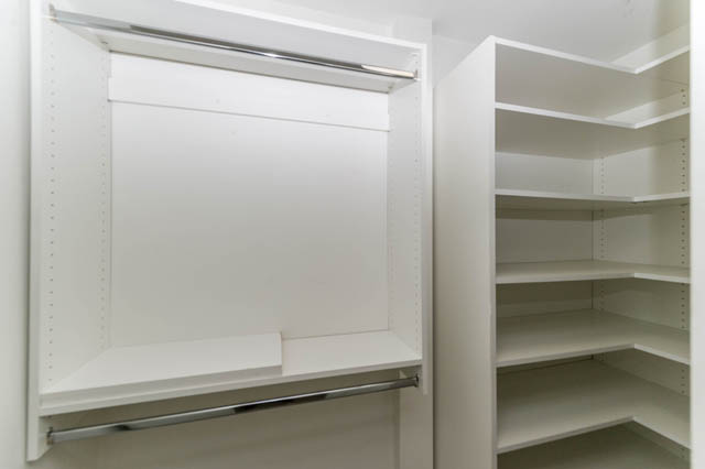 Bright walk-in closet with adjustable shelves and hanging rod. - 3205 - 928 Richards St, Vancouver Downtown