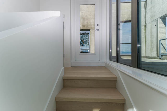 Bright living room with hardwood floors and large windows offering a city view. - 3205 - 928 Richards St, Vancouver Downtown