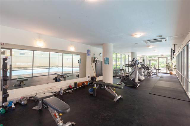 Spacious penthouse living room with large windows, city view, and modern furnishings. - 3205 - 928 Richards St, Vancouver Downtown