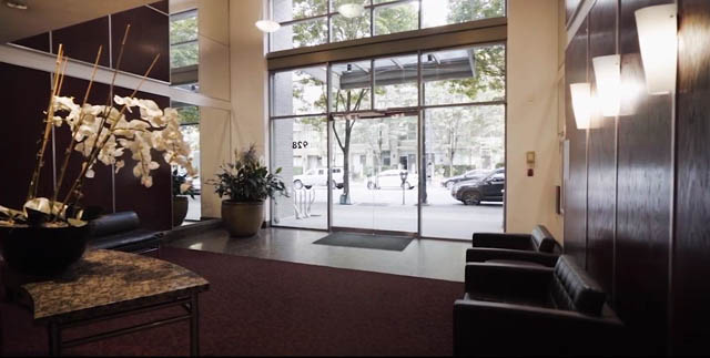 Furnished living room with large windows, city view, and modern decor. - 3205 - 928 Richards St, Vancouver Downtown