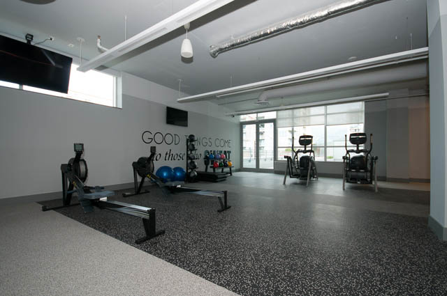 Furnished 1-bedroom condo with modern fitness equipment and city view. - 1105 - 125 E 14th St, North Vancouver