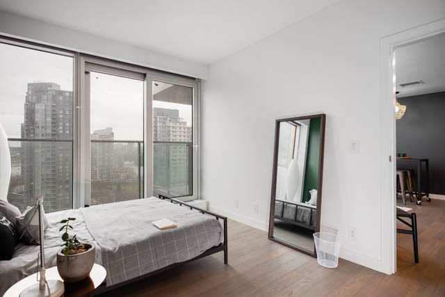 Furnished 1-bedroom with hardwood floors, city view, and modern decor. - 1901 - 1480 Howe St, Vancouver Downtown