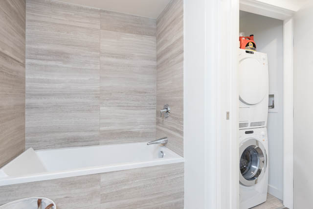 Bathroom with modern fixtures and a washer/dryer combo. - 1901 - 1480 Howe St, Vancouver Downtown