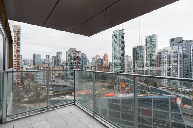 Bright balcony with stunning city view, modern furnishings, and sleek design. - 1901 - 1480 Howe St, Vancouver Downtown