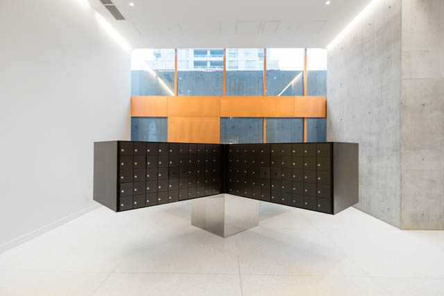 Furnished 1-bedroom condo with modern black cabinets and concrete walls. - 1901 - 1480 Howe St, Vancouver Downtown