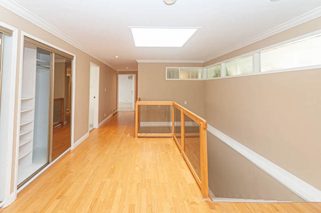Bright hallway with hardwood floors and a skylight. - 669 Eyremount Drive, West Vancouver