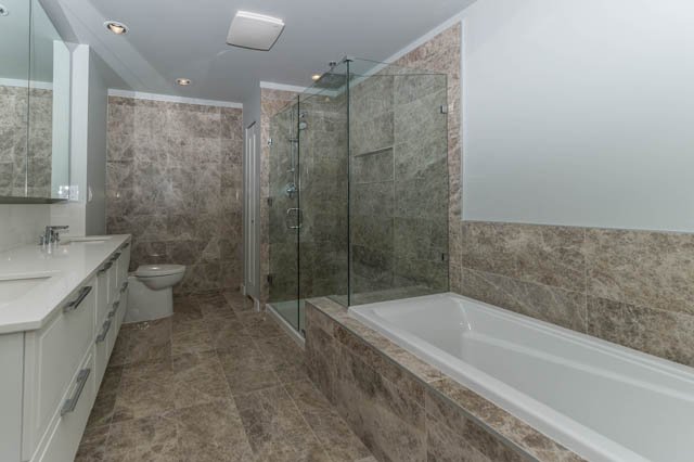 Spacious bathroom with marble countertops and walk-in shower. - 802 - 118 Carrie Cates Court, North Vancouver