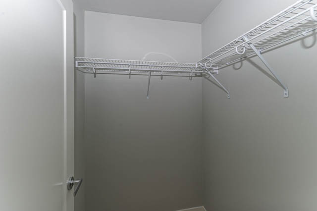 Empty closet with wire shelving and hooks. - 802 - 118 Carrie Cates Court, North Vancouver