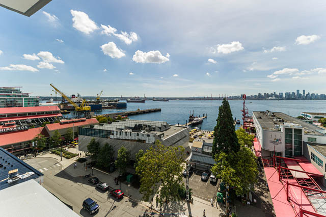 Bright living room with city view and waterfront access. - 802 - 118 Carrie Cates Court, North Vancouver