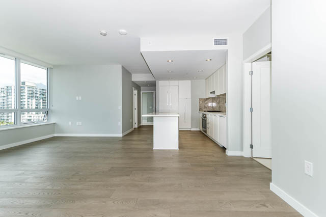 Bright living room with hardwood floors and city view. - 802 - 118 Carrie Cates Court, North Vancouver