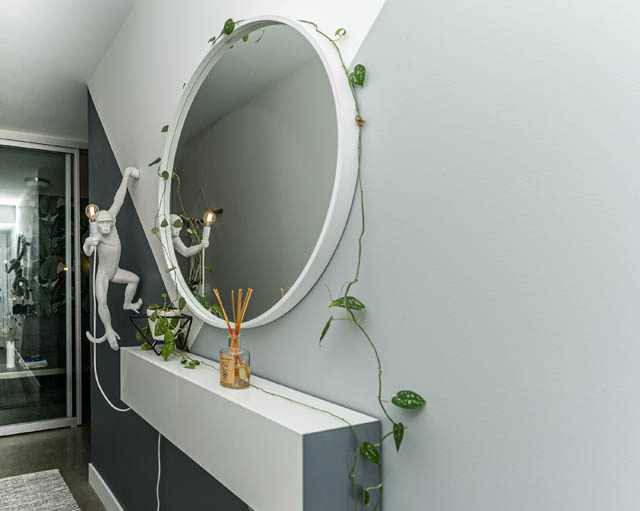 Bright bathroom with modern decor, white countertop, and wall-mounted mirror. - 501 - 231 E Pender Street, Vancouver Downtown