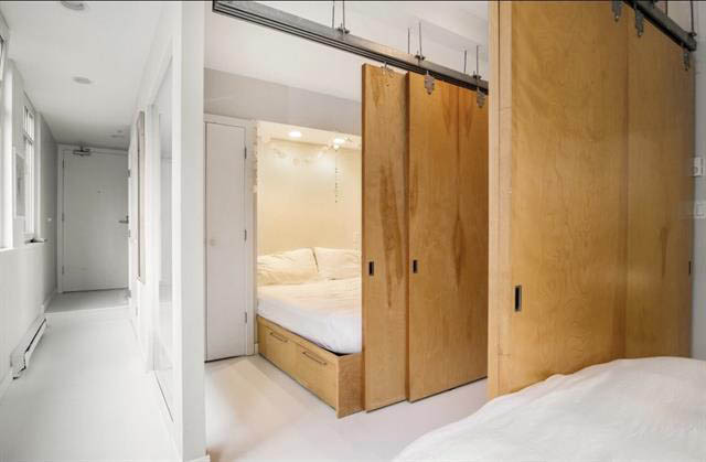 Bright loft bedroom with sliding wooden doors and built-in storage. - 410 - 1072 Hamilton St, Vancouver Downtown