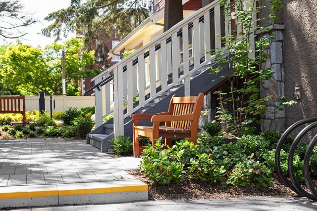 Furnished patio with wooden bench and greenery, steps leading up to a house. - 201 - 1785 W 16th Avenue, Vancouver West Side