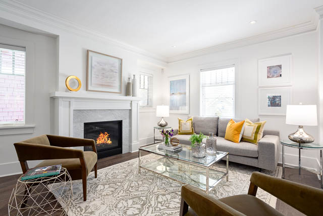 Bright living room with modern furniture, fireplace, and large windows. - 201 - 1785 W 16th Avenue, Vancouver West Side
