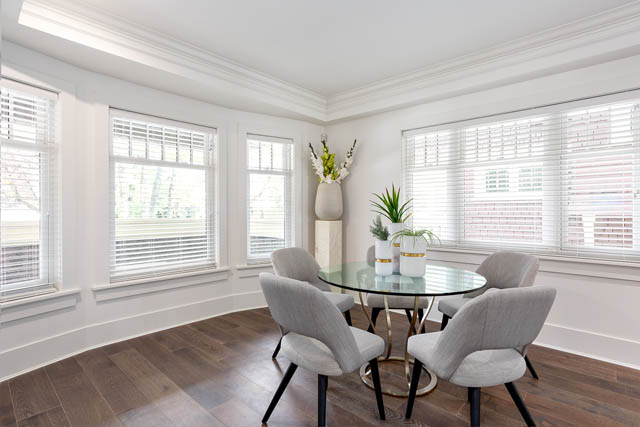 Bright dining room with hardwood floors and large windows, showcasing a modern and airy feel. - 201 - 1785 W 16th Avenue, Vancouver West Side