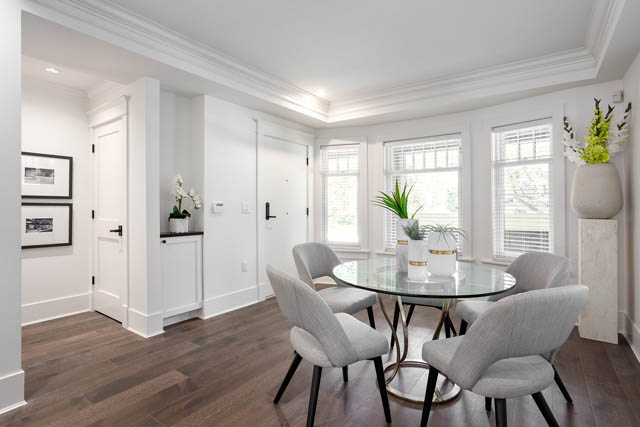 Furnished dining room with hardwood floors and large windows. - 201 - 1785 W 16th Avenue, Vancouver West Side