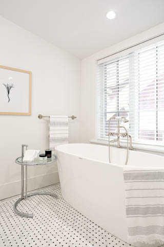 Bright bathroom with a freestanding tub, white walls, and a window with blinds. - 201 - 1785 W 16th Avenue, Vancouver West Side