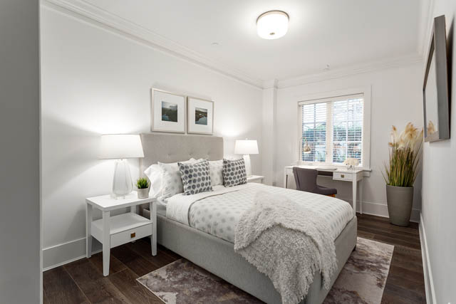 Bright bedroom with white walls, gray headboard, and wooden floors. - 201 - 1785 W 16th Avenue, Vancouver West Side