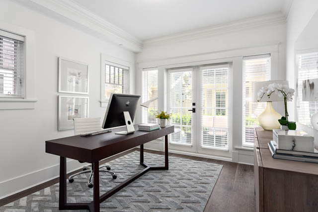 Bright and airy office with large windows, modern decor, and a sleek desk setup. - 201 - 1785 W 16th Avenue, Vancouver West Side