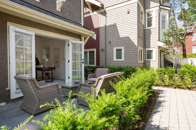 Furnished patio with wicker furniture and lush greenery. - 201 - 1785 W 16th Avenue, Vancouver West Side