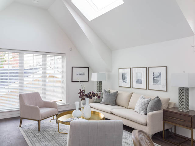 Bright living room with high ceilings, skylight, and modern decor. - 3170 Burrard St, Vancouver West Side