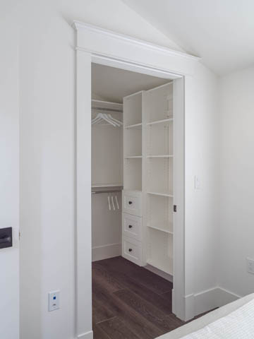 Furnished bedroom with built-in closet and hardwood floors. - 3170 Burrard St, Vancouver West Side