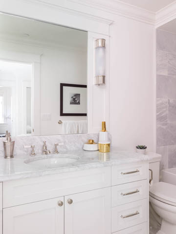 Bright bathroom with marble countertops and a modern vanity. - 3170 Burrard St, Vancouver West Side