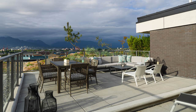 Furnished penthouse with a cozy outdoor patio, city view, and modern furniture. - 805 -  210 E 5th Avenue, Vancouver East Side