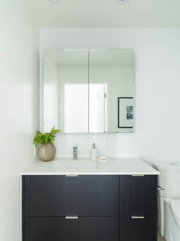 Bright bathroom with white countertop and black cabinet, modern design. - 805 -  210 E 5th Avenue, Vancouver East Side
