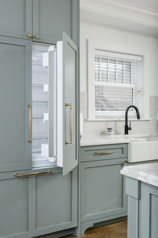 Bright kitchen with light blue cabinets, white countertops, and a modern sink. - 200 - 1775 W 16th Avenue, Vancouver West Side