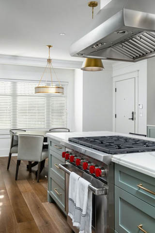 Bright kitchen with white countertops, stainless steel appliances, and hardwood floors. - 200 - 1775 W 16th Avenue, Vancouver West Side