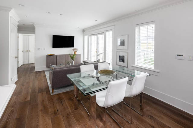 Bright dining and living area with hardwood floors, modern furniture, and large windows. - 	1783 W 16th Ave, Vancouver West Side
