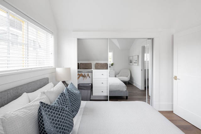 Bright and airy bedroom with large windows, white walls, and a cozy bed setup. - 	1783 W 16th Ave, Vancouver West Side