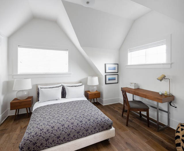 Bright bedroom with hardwood floors, white walls, and a desk. - 	1783 W 16th Ave, Vancouver West Side