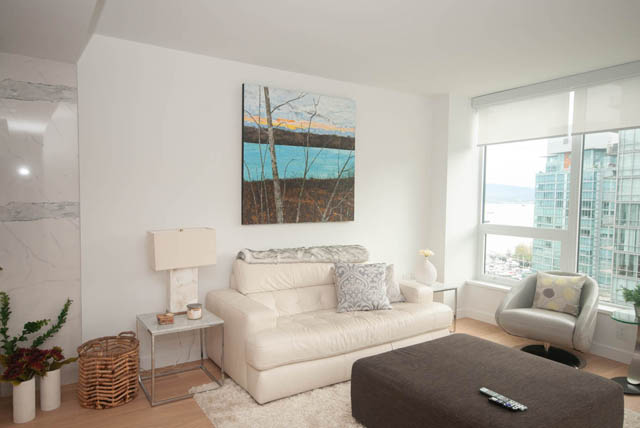Bright living room with modern decor, city view, and large windows. - 1803 - 620 Cardero Street, Vancouver Downtown