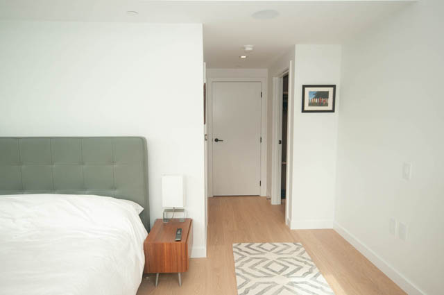 Bright bedroom with modern furniture, hardwood floors, and a stylish headboard. - 1803 - 620 Cardero Street, Vancouver Downtown