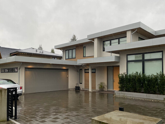 Modern 1-bedroom suite with large windows and sleek exterior design. - Suite - 2825 Edgemont Blvd, North Vancouver