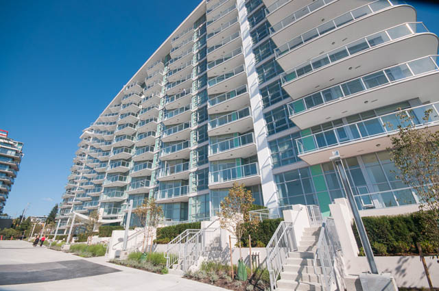 Furnished 1-bedroom condo with modern balcony and city views. - 105 - 199 Victory Ship Way, North Vancouver
