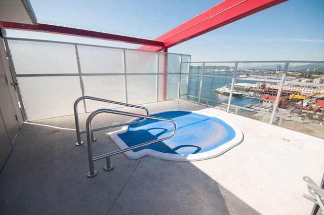 Bright balcony with city view and modern railings. - 105 - 199 Victory Ship Way, North Vancouver