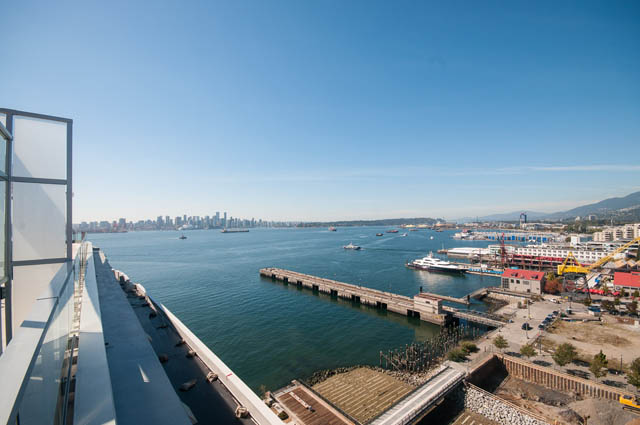 Bright balcony with stunning city view and harbor access. - 105 - 199 Victory Ship Way, North Vancouver