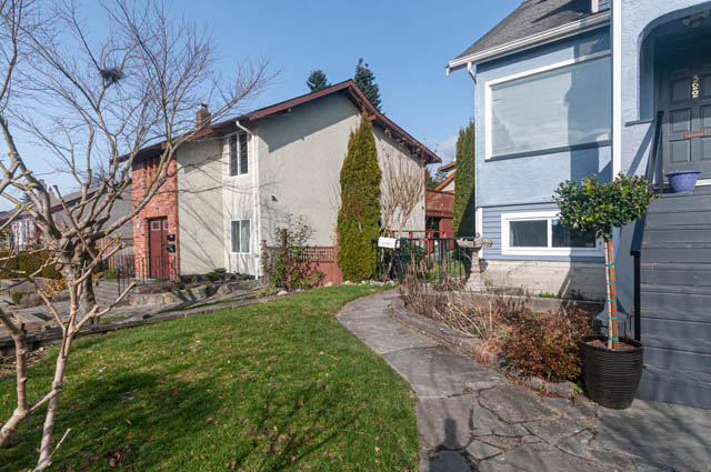 Furnished 1-bedroom + den suite with a cozy living area and a small garden. - Suite - 522 5th St E, North Vancouver