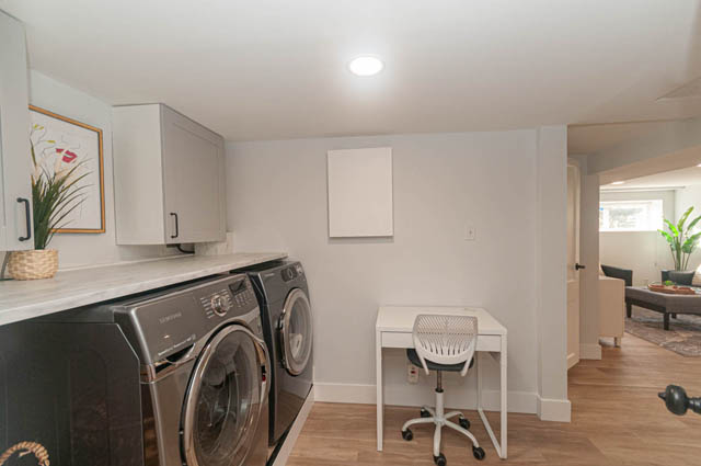 Furnished living space with hardwood floors and modern decor. - Suite - 522 5th St E, North Vancouver