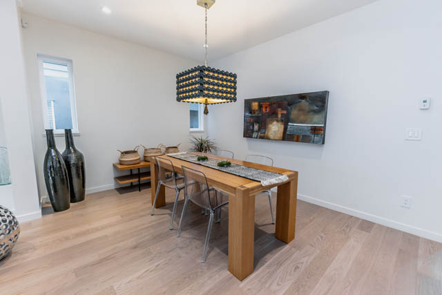 Furnished dining area with hardwood floors and modern decor. - Address WITHHELD, North Vancouver