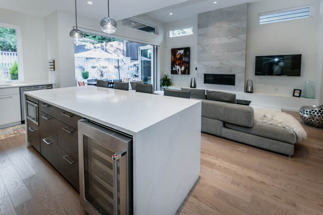 Bright kitchen with white countertops, hardwood floors, and a city view. - Address WITHHELD, North Vancouver