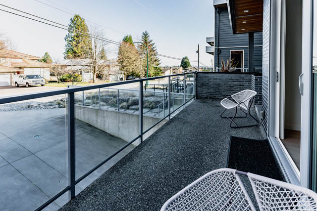 Furnished balcony with modern furniture and city view. - Address WITHHELD, North Vancouver