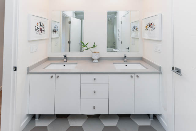 Bright bathroom with modern vanity and large mirrors. - Address WITHHELD, North Vancouver