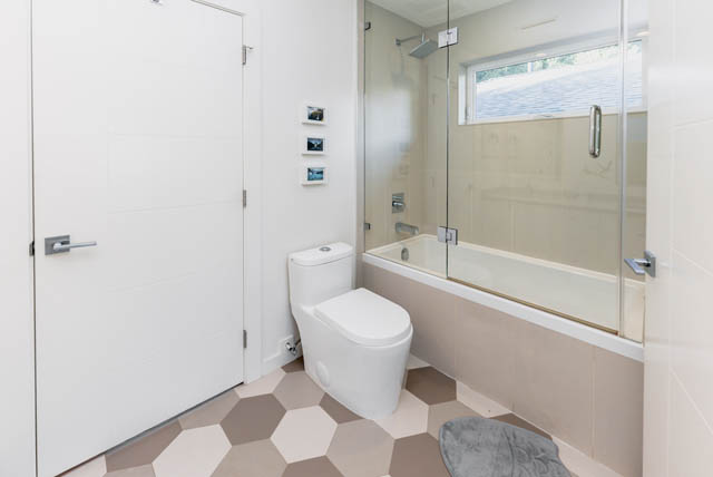 Bright bathroom with hexagonal tile floor and glass shower. - Address WITHHELD, North Vancouver