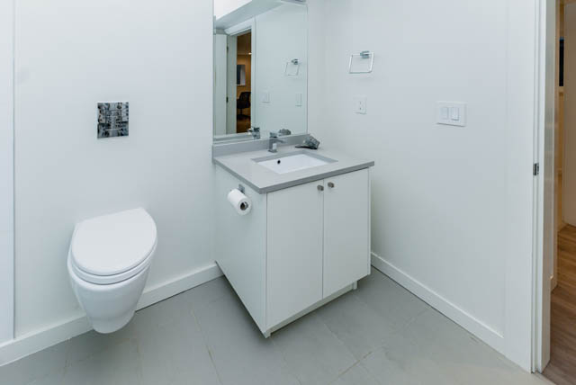 Bright bathroom with white vanity and countertop, hardwood floors. - Address WITHHELD, North Vancouver