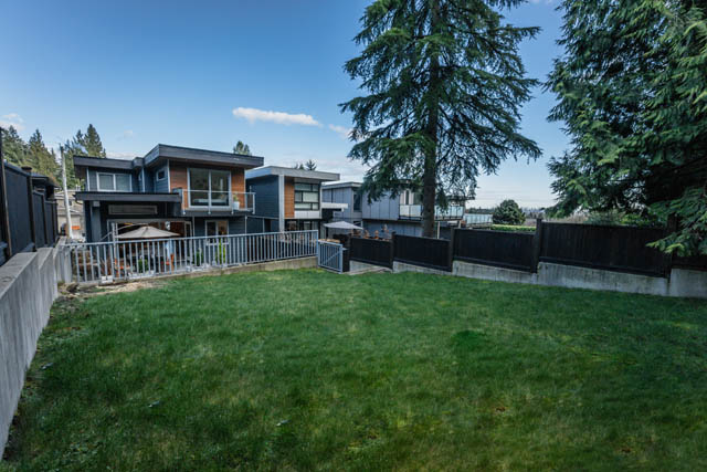 Spacious backyard with grass and trees, perfect for relaxation. - Address WITHHELD, North Vancouver