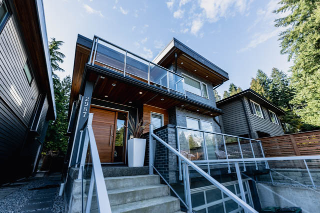 Furnished 4-bedroom house with modern design, glass railings, and wooden accents. - Address WITHHELD, North Vancouver
